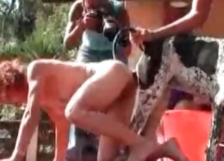 MILF fucking a huge dog