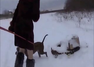 Cute babe swallows a load of dog cum on the snow